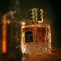 Vintage perfume bottle with intricate design on a dark background